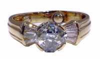 Lot 216 - 18ct yellow gold diamond ring, the fancy cut central diamond weighing approx. 1.79ct, tapered baguette diamond shoulders, approx. 0.60ct total, gross