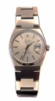 Lot 234 - Gent's Rolex Oyster Quartz datejust steel bracelet watch, round steel dial, applied batons, date window to 3 'o' clock, tonneau shaped steel head, cas