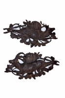 Lot 448 - A pair of Victorian carved black forest wall plaques