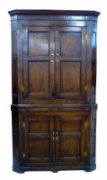 Lot 476 - George III oak corner cupboard.
