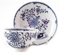 Lot 144 - Lowestoft tea-bowl and saucer painted with a rare under-glaze blue pattern c.1775.