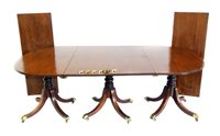 Lot 688 - George III mahogany three pedestal regency design dining table.