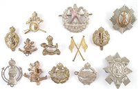 Lot 99 - A collection of cap badges