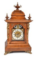 Lot 653 - A Victorian walnut bracket clock