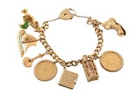 Lot 412 - A charm bracelet, 9ct gold complete with sovereign coin, American five dollar coin and assorted 9ct and base metal charms