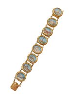 Lot 399 - Indian gold bracelet composed of 8 oval miniature paintings on ivory of famous Indian temples, each approximately 17 x 13mm, overall length 17.5cm.