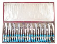 Lot 220 - A cased set of porcelain knives and forks
