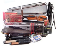 Lot 156 - A collection of musical instruments and related items to include a Koreen electric violin in case, Akai Ewi USB wind instrument, two Asian wind instruments and various accessories
