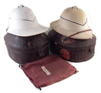 Lot 89 - Two pithe helmets in tins