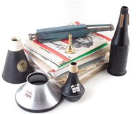 Lot 128 - A collection of music stand and various mutes, and a Denis Wick mouth piece