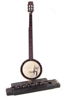 Lot 23 - J.E. Dallas banjo and a C.M.H. Indian banjo