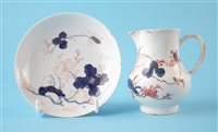 Lot 65 - Bow jug and a saucer