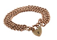Lot 408 - 9ct gold two-row bracelet and heart-shaped padlock fastener