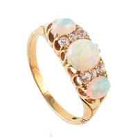 Lot 383 - Opal 3-stone and diamond set boat head 18ct gold ring
