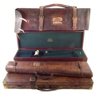 Lot 40 - Three leather shotgun cases.