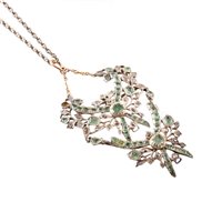 Lot 387 - Emerald and diamond set two-section drop garland style pendant and chain