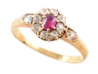 Lot 397 - Circa 1900 ruby and diamond round cluster 18ct gold ring with diamond set shoulders