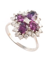 Lot 403 - 18ct white gold sapphire and diamond flower head cluster ring