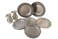 Lot 32 - A pair of George III pot bellied tappit hens, four five lobed pewter plates and two circular dinner plates.