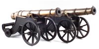 Lot 18 - Two similar bronze model cannons on cast iron bases