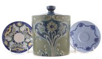 Lot 256 - Moorcroft biscuit barrel and two saucers