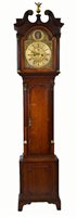 Lot 663 - A 19th century mahogany longcase clock with glancing eyes.