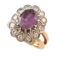 Lot 440 - Amethyst and diamond 18ct gold cluster ring