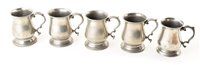 Lot 163 - A set of four pewter tankards by W.R Loftus, 146 Oxford Street, London.